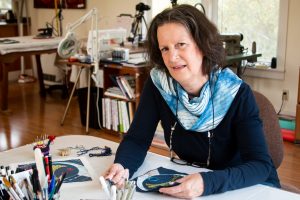 April Sproule at her work table